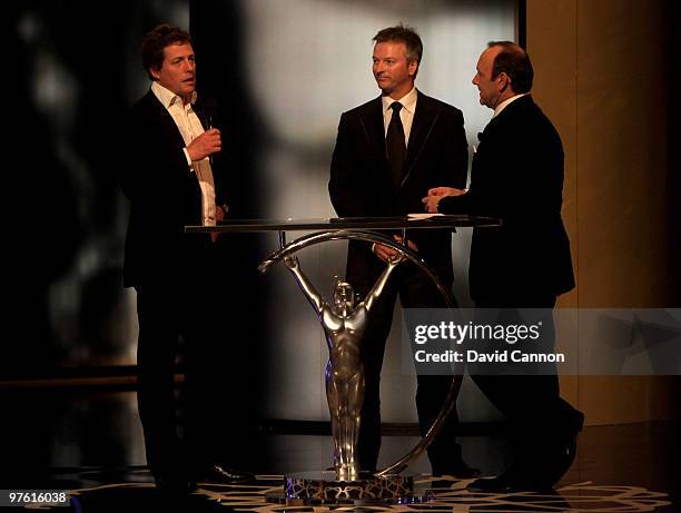 Hugh Grant , Steve Waugh Kevin Spacey on stage during the Laureus World Sports Awards 2010 at Emirates Palace Hotel on March 10, 2010 in Abu Dhabi,...