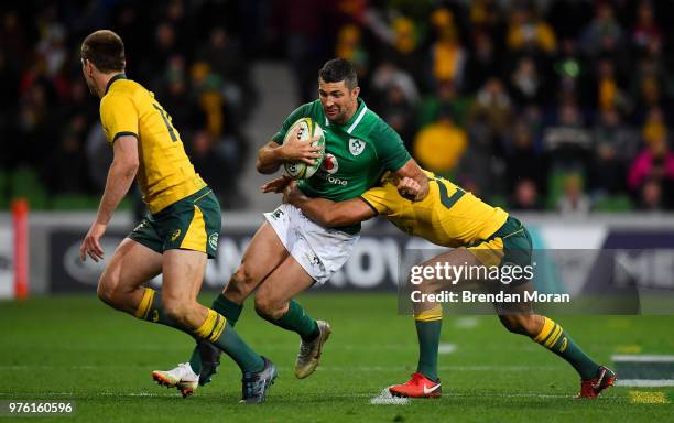 Melbourne , Australia - 16 June 2018; Rob Kearney of Ireland is tackled by Nick Phipps of Australia during the 2018 Mitsubishi Estate Ireland Series...