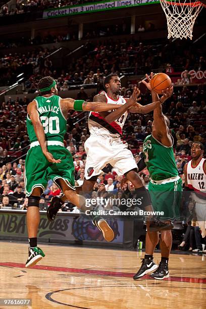 Martell Webster of the Portland Trail Blazers drives to the basket for a layup against Rasheed Wallace and Glen Davis of the Boston Celtics during...