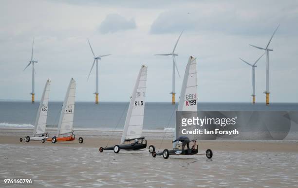 Competitors race during the National Land Sailing regatta held on Coatham Sands on June 16, 2018 in Redcar, England. Land sailing events held on the...