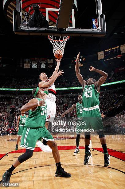 Brandon Roy of the Portland Trail Blazers shoots a layup against Paul Pierce and Kendrick Perkins of the Boston Celtics during the game at The Rose...