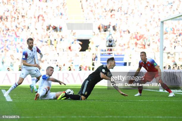 Lucas Biglia of Argentina is tackled by Ragnar Sigurdsson of Iceland during the 2018 FIFA World Cup Russia group D match between Argentina and...