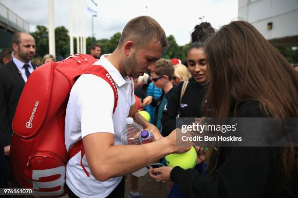 Dan Evans of Great Britain signs autographs for fans after the Mens Singles Semi Final during Day Eight of the Nature Valley Open at Nottingham...