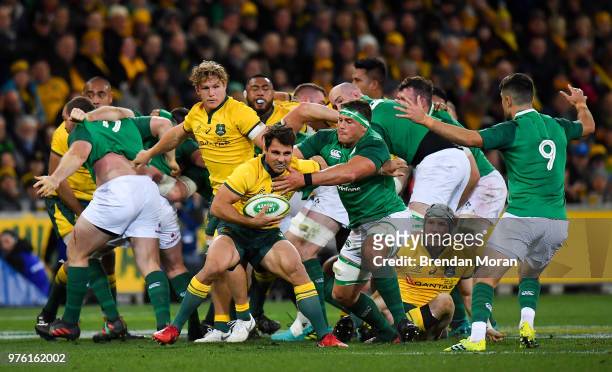 Melbourne , Australia - 16 June 2018; Nick Phipps of Australia is tackled by CJ Stander of Ireland during the 2018 Mitsubishi Estate Ireland Series...