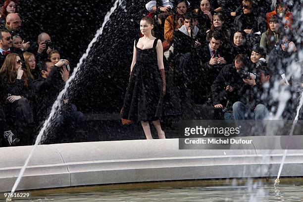 Laetitia Casta walks the runway during the Louis Vuitton Ready to Wear show as part of the Paris Womenswear Fashion Week Fall/Winter 2011 at Cour...