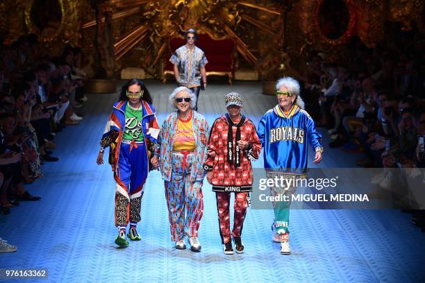 Models present creations by Dolce & Gabbana during the men & women's spring/summer 2019 collection fashion show in Milan, on June 16, 2018.