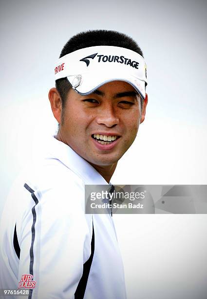 Yuta Ikeda of Japan smiles on the practice range during practice for the World Golf Championships-CA Championship at Doral Golf Resort and Spa on...
