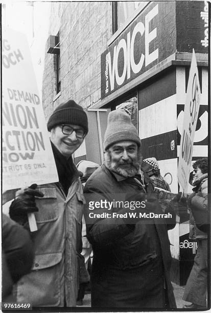 American cartoonist Jules Feiffer and journalist and music critic Nat Hentoff demonstrate outside the offices of the Village Voice during a union...