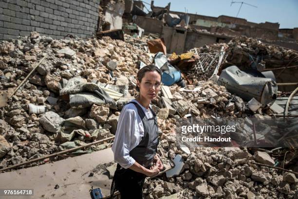 In this handout image provided by United Nations High Commission for Refugees, UNHCR Special Envoy Angelina Jolie visits the Old City in West Mosul...