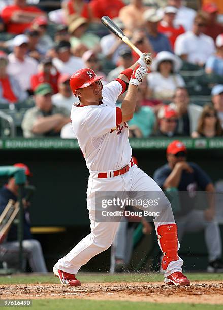 First baseman Allen Craig of the St Louis Cardinals hits a double against the Washington Nationals at Roger Dean Stadium on March 10, 2010 in...