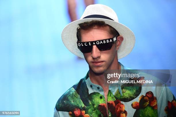 Model presents a creation by Dolce & Gabbana during the men & women's spring/summer 2019 collection fashion show in Milan, on June 16, 2018.