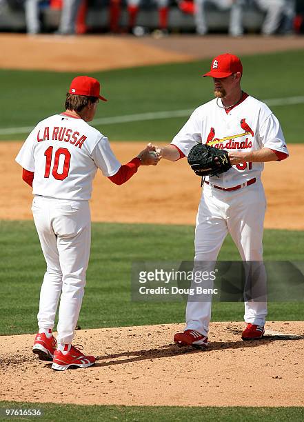 Relief pitcher Ryan Franklin of the St Louis Cardinals is relieved by manager Tony La Russa while taking on the Washington Nationals at Roger Dean...