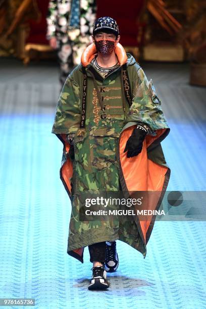 Model presents a creation by Dolce & Gabbana during the men & women's spring/summer 2019 collection fashion show in Milan, on June 16, 2018.