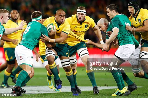 Caleb Timu of the Wallabies runs with the ball whilst being tackled by Devin Toner of Ireland during the International test match between the...