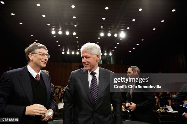 Bill Gates , co-founder and co-chair of the Bill & Melinda Gates Foundation, and former U.S. President Bill Clinton talk after testifying before the...