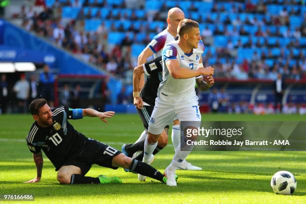 Lionel Messi of Argentina competes with Johann Gudmundsson of Iceland during the 2018 FIFA World Cup Russia group D match between Argentina and...