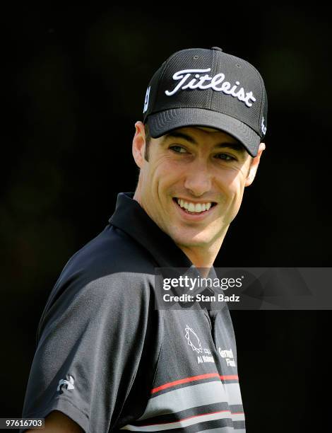 Ross Fisher of England smiles on the practice range during practice for the World Golf Championships-CA Championship at Doral Golf Resort and Spa on...