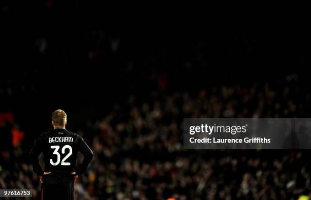 David Beckham of AC Milan looks on during the UEFA Champions League First Knockout Round, second leg match between Manchester United and AC Milan at...