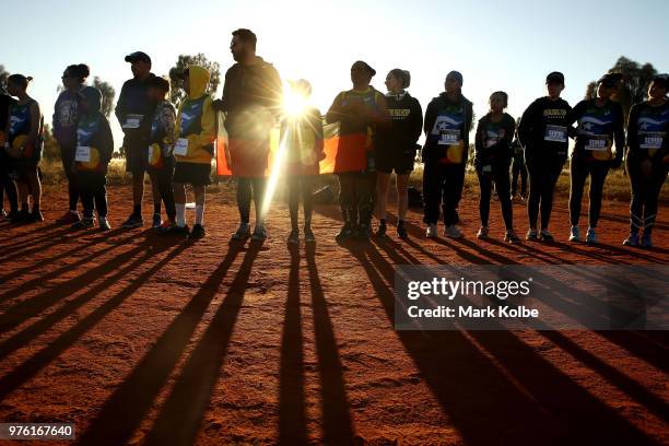 Runners are seen as they stand a circle to introduce themselves before the Deadly Fun Run during the the National Deadly Fun Run Championships on...