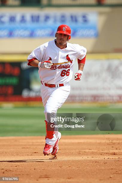 First baseman Allen Craig of the St Louis Cardinals rounds second base after hitting a home run against the Washington Nationals at Roger Dean...