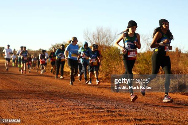Runners take part in the Deadly Fun Run during the the National Deadly Fun Run Championships on June 16, 2018 in Uluru, Australia. The annual running...