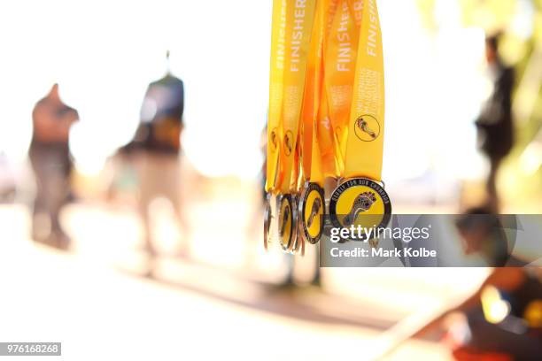 Finisher medals are as runners finish the Deadly Fun Run during the the National Deadly Fun Run Championships on June 16, 2018 in Uluru, Australia....