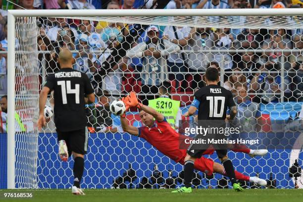 Hannes Halldorsson of Iceland saves a penalty from Lionel Messi of Argentina during the 2018 FIFA World Cup Russia group D match between Argentina...