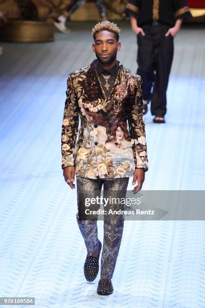 Tinie Tempah walks the runway at the Dolce & Gabbana show during Milan Men's Fashion Week Spring/Summer 2019 on June 16, 2018 in Milan, Italy.