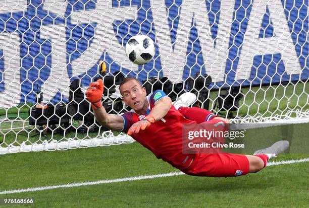 Hannes Halldorsson of Iceland saves a penalty kick from Lionel Messi of Argentina during the 2018 FIFA World Cup Russia group D match between...