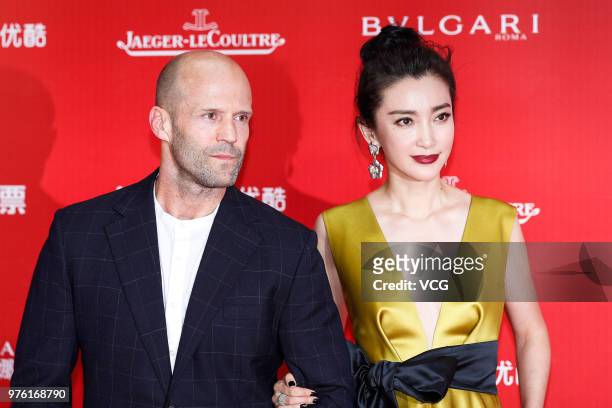 English actor Jason Statham and actress Li Bingbing arrive at the opening ceremony of the 21st Shanghai International Film Festival at Shanghai Grand...
