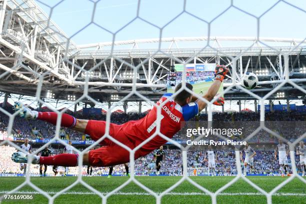 Hannes Halldorsson of Iceland saves a penalty kick from Lionel Messi of Argentina during the 2018 FIFA World Cup Russia group D match between...