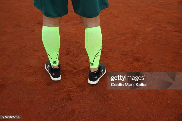 The legs of Australian olympic bobsledder Lucas Mata are seen as he warms-up before the Deadly Fun Run during the the National Deadly Fun Run...