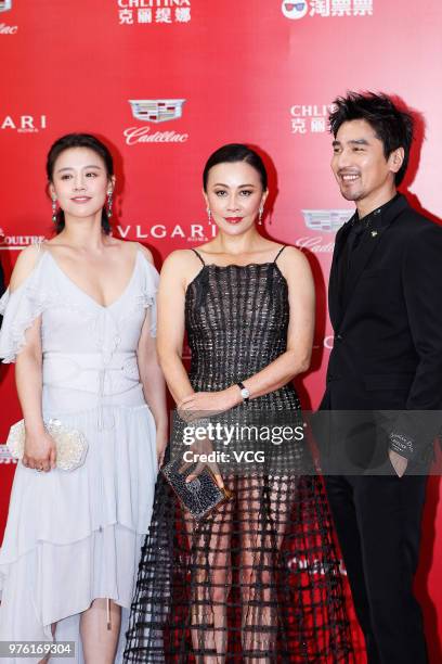 Actress Sandra Ma Sichun, actress Carina Lau and actor Mark Chao arrive at the opening ceremony of the 21st Shanghai International Film Festival at...