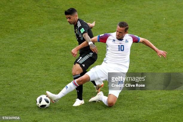 Ever Banega of Argentina is challenged by Gylfi Sigurdsson of Iceland during the 2018 FIFA World Cup Russia group D match between Argentina and...