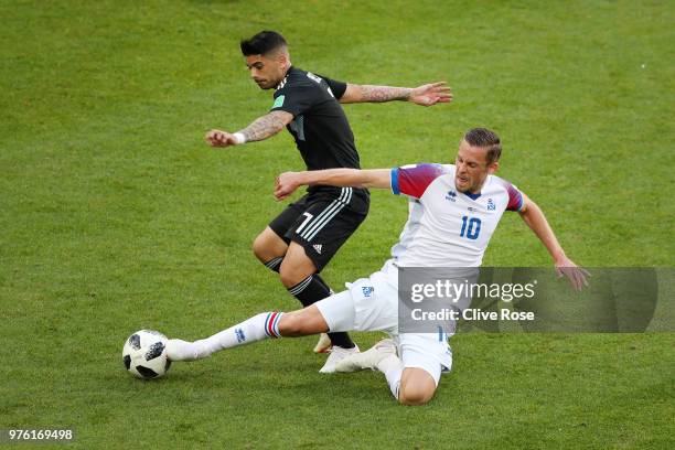 Ever Banega of Argentina is challenged by Gylfi Sigurdsson of Iceland during the 2018 FIFA World Cup Russia group D match between Argentina and...