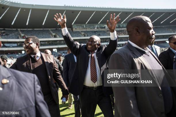 South African President Cyril Ramaphosa greets the crowd as he arrives for the 2018 National Youth Day Commemoration under the theme, 'Live the...