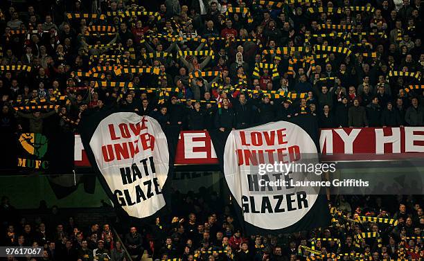 Manchester United fans reveal anti Glazer banners during the UEFA Champions League First Knockout Round, second leg match between Manchester United...