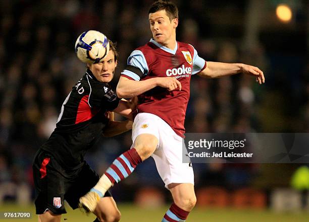 David Nugent of Burnley flicks the ball over Dean Whitehead of Stoke City during the Barclays Premier League match between Burnley and Stoke City at...
