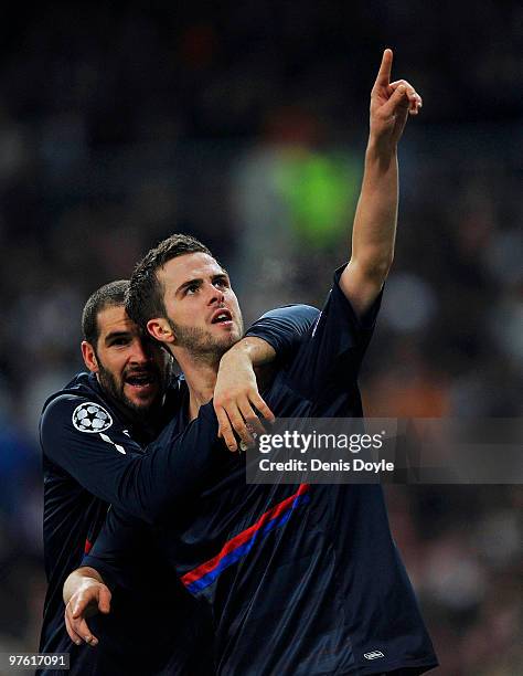 Miralem Pjanic of Olympique Lyonnais celebrates after scoring Lyonnais' first goal during the UEFA Champions League round of 16 2nd leg match between...