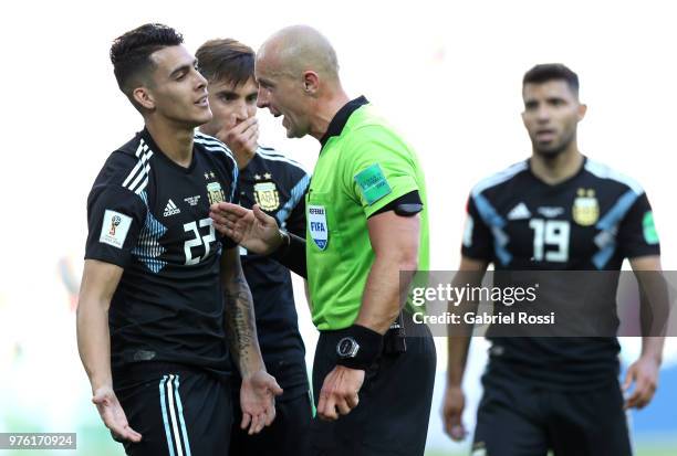 Cristian Pavon of Argentina argues with Referee Szymon Marciniak during the 2018 FIFA World Cup Russia group D match between Argentina and Iceland at...
