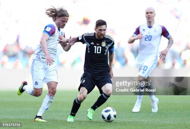 Birkir Bjarnason of Iceland and Lionel Messi of Argentina battle for the ball during the 2018 FIFA World Cup Russia group D match between Argentina...