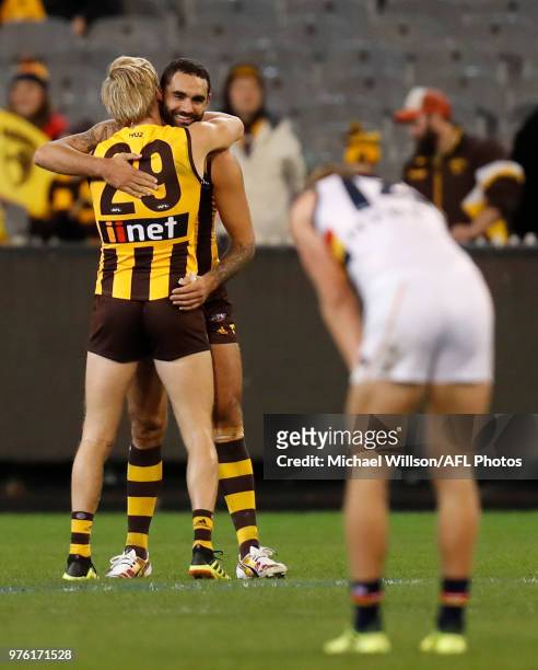 Will Langford and Shaun Burgoyne of the Hawks celebrate during the 2018 AFL round 13 match between the Hawthorn Hawks and the Adelaide Crows at the...