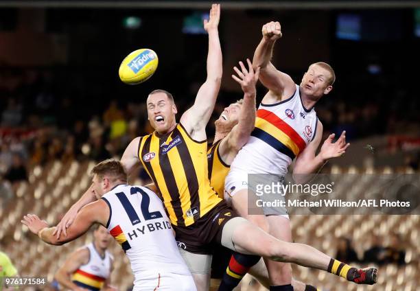 Daniel Talia of the Crows, Jarryd Roughead of the Hawks, Ben McEvoy of the Hawks and Sam Jacobs of the Crows compete for the ball during the 2018 AFL...