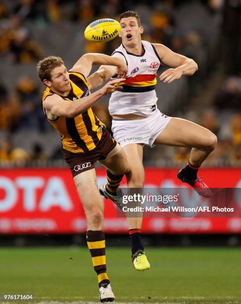 Ben McEvoy of the Hawks and Josh Jenkins of the Crows compete in a ruck contest during the 2018 AFL round 13 match between the Hawthorn Hawks and the...