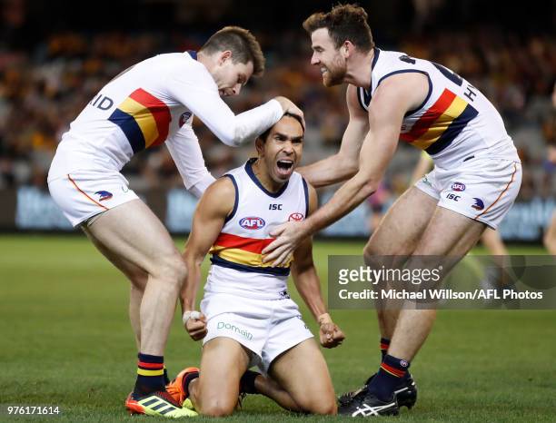 Eddie Betts of the Crows celebrates a goal with teammates Bryce Gibbs and Andy Otten during the 2018 AFL round 13 match between the Hawthorn Hawks...