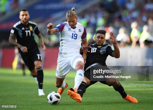 Eduardo Salvio of Argentina tackles Rurik Gislason of Iceland during the 2018 FIFA World Cup Russia group D match between Argentina and Iceland at...