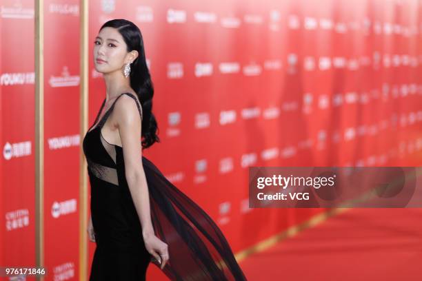 Swiss-born British actress Clara Lee Sung-min arrives at the opening ceremony of the 21st Shanghai International Film Festival at Shanghai Grand...