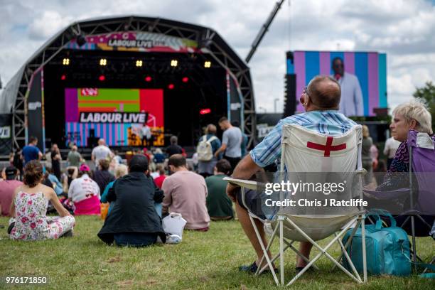 Festival attendees watch David Lammy MP speak on the main stage at Labour Live, White Hart Lane, Tottenham on June 16, 2018 in London, England. The...