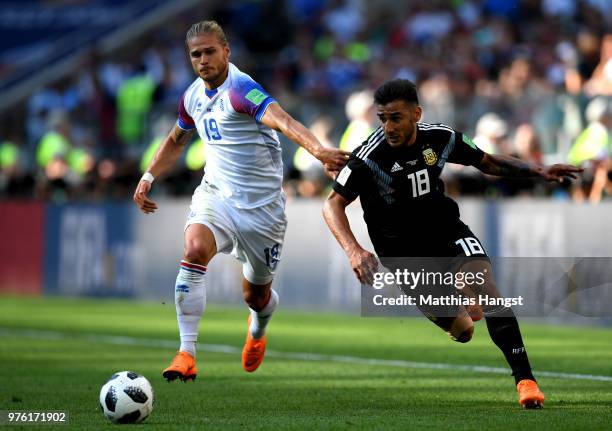 Eduardo Salvio of Argentina is challenged by Rurik Gislason of Iceland during the 2018 FIFA World Cup Russia group D match between Argentina and...