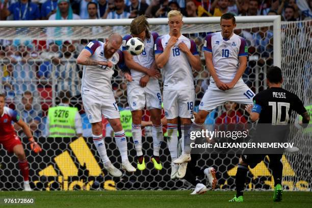 Argentina's forward Lionel Messi kicks a free kick during the Russia 2018 World Cup Group D football match between Argentina and Iceland at the...